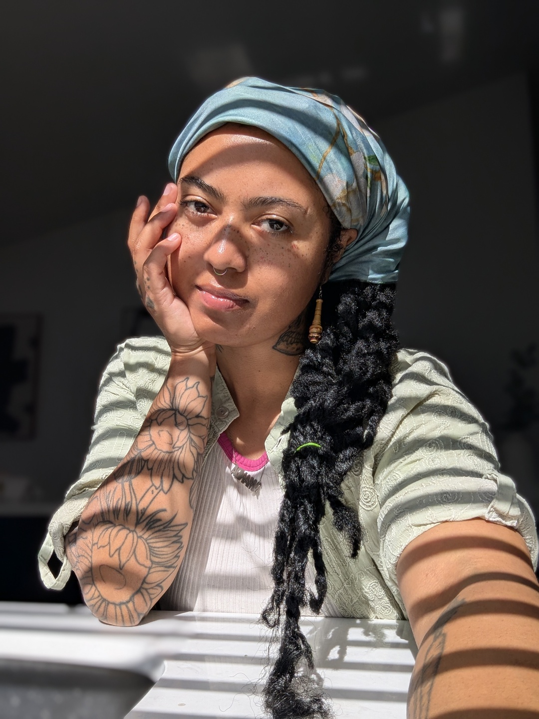 Portrait of the artist in a front of a sunny window